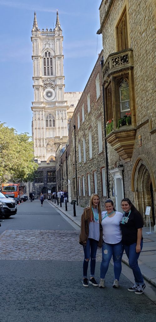 Girls in front of Westminster Abbey, London, England, Summer Three-city tour